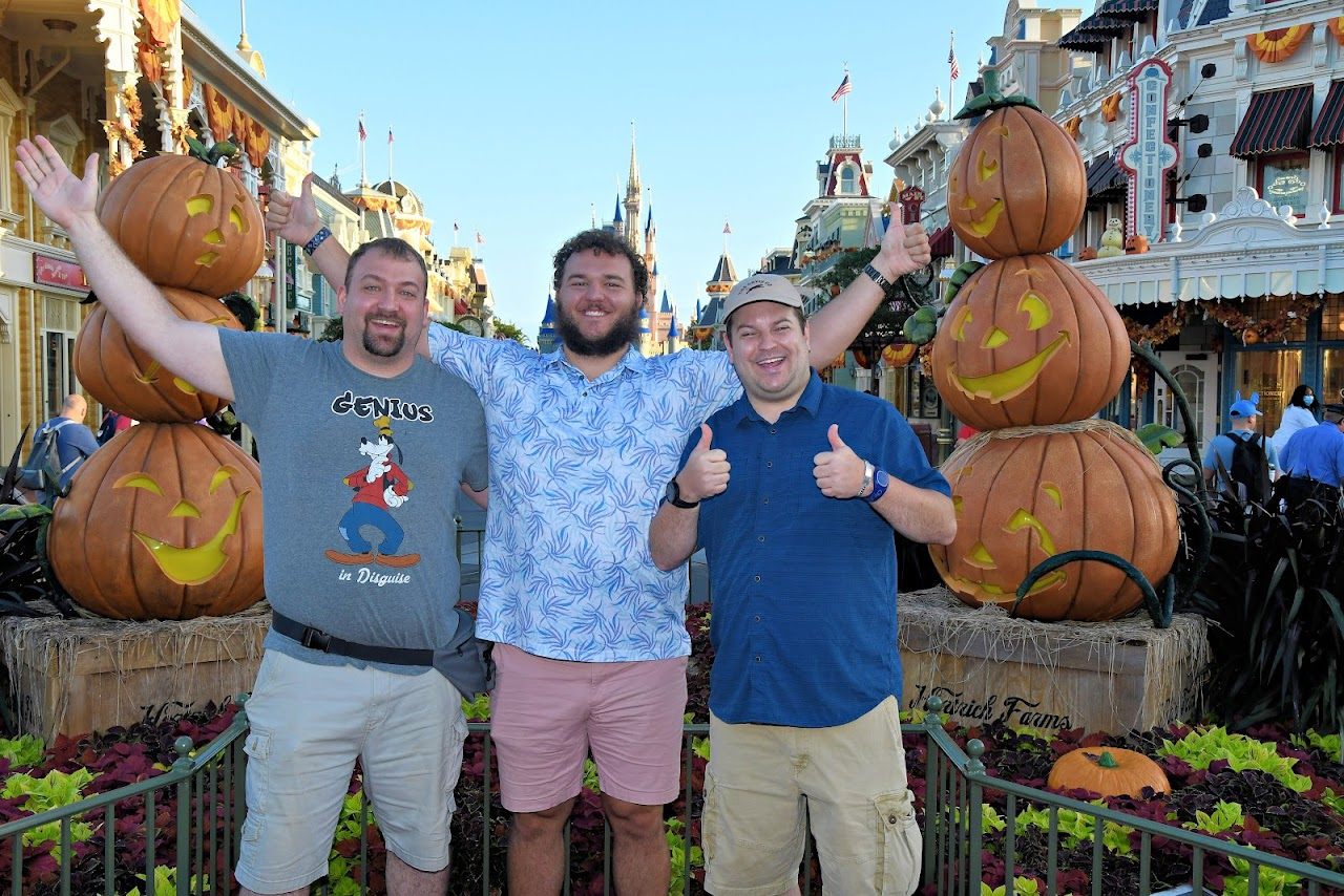 Spencer Callicott and friends in front of giant Halloween pumpkins at Magic Kingdom
