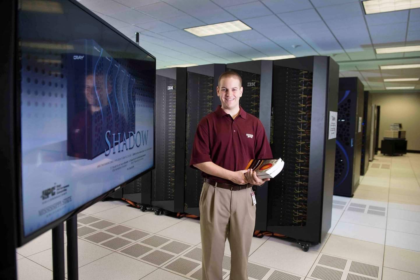Spencer Callicott at Mississippi State University next to the SHADOW supercomputer