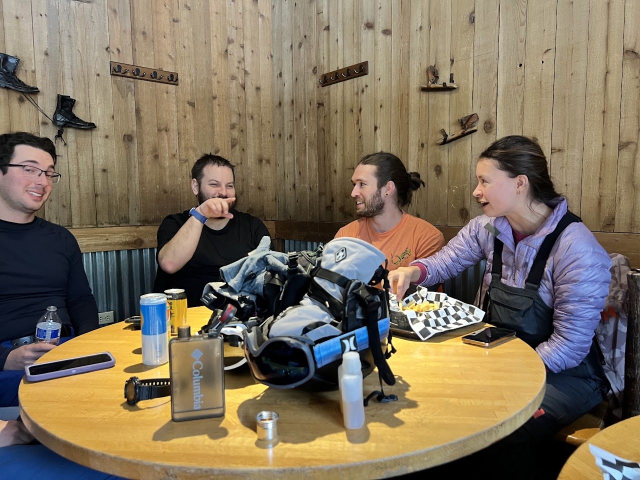 Spencer Callicott telling a story over lunch mid-ski trip in the mountains